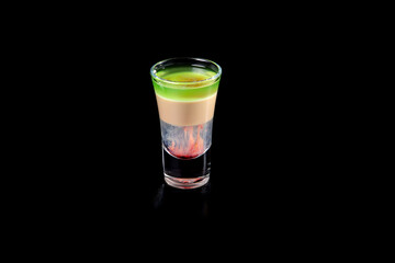 aperitif is an alcoholic cocktail made from various ingredients. Cocktail - one glass on a black...