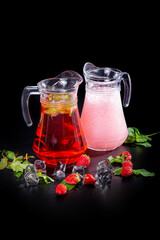 A teapot with black and green tea from various varieties of leaves. Tea drink with pieces of citrus fruits. concept is a tea ceremony.