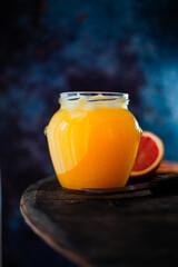 honey in a jar and a spoon