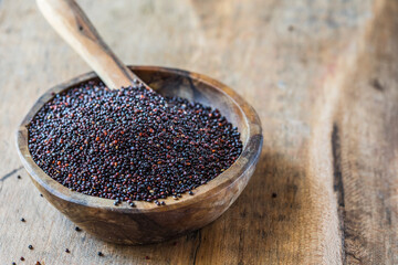 Chenopodium quinoa - Organic quinoa seeds in the wooden bowl