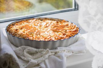 Apple pie. Piece of fresh baked homemade layered tart with fresh apples.