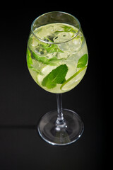 Aperitif is a refreshing cocktail of lemonade made from citrus slices. Soft drink with syrup and soda and ice cubes. Concept - summer thirst