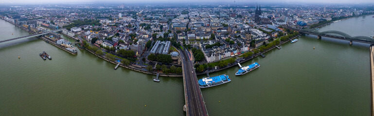 Aerial view of the old town of cologne on a rainy, cloudy and foggy morning in summer. - obrazy, fototapety, plakaty