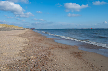 View on white sandy  beach, dunes and water of North sea between Vlissingen en Domburg, Zeeland, Netherlands