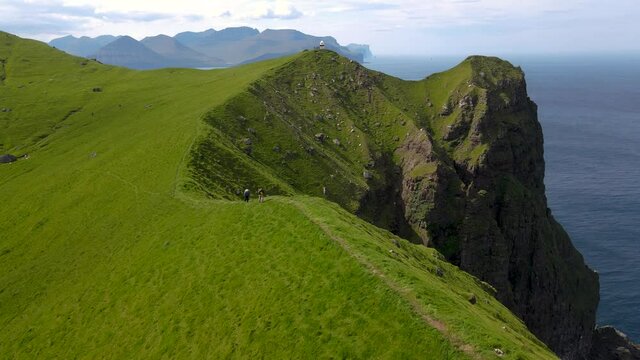 Beautiful aerial footages of the Kallur Light house in the Faroe Islands, and its massive cliffs, crags hikes and ocean views