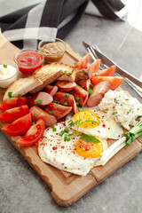bruschetta with tomato, sausages and eggs