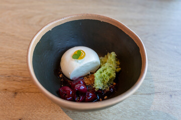 Tasty lemon mousse cream with sour cherry dessert