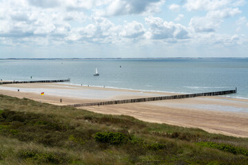 View on white sandy  beach, dunes and water of North sea between Vlissingen en Domburg, Zeeland, Netherlands