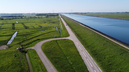 Aerial view on green polders, meadows and water transportion channel in South Beveland, Zeeland,...