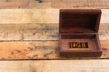 Small gold ingot inside in box