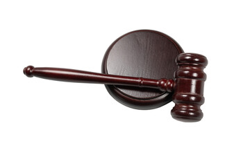 Wooden judge gavel and soundboard isolated on a white background.