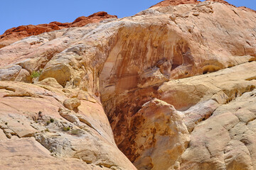 Fototapeta na wymiar Shallow canyon walls amongst the rock outcroppings in the Nevada Desert
