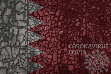 flag of bahrain on a old metal rusty cracked wall with text coronavirus, covid, and virus picture.