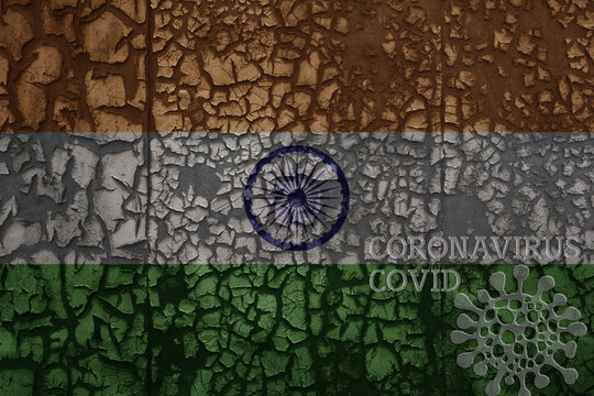 Flag Of India On A Old Metal Rusty Cracked Wall With Text Coronavirus, Covid, And Virus Picture.