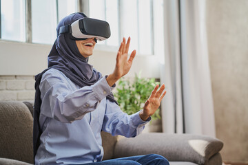 Muslim woman exploring new virtual worlds with a VR headset