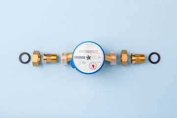 replacement of water supply and sewerage. New water meter and details on blue background. Repair in...