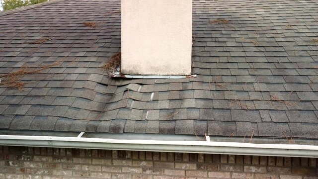 Roof and shingles damaged from water leak and leaves