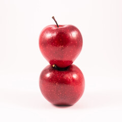 Two tasty red apples on white background, healthy lifestyle