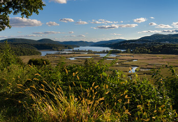Scenic view of Constitution Island marshes and the Hudson River surrounded by mountains from east...