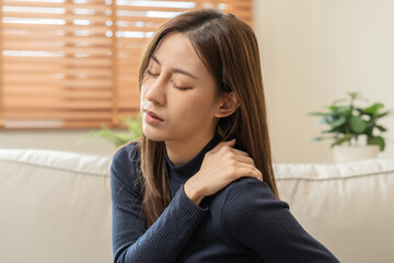 Body muscles stiff problem, asian young attractive woman, girl pain with back pain ache from work,...