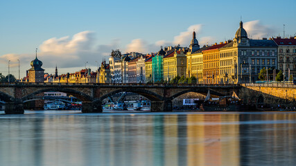 Prague's waterside by the Vltava river called Prazska naplavka in twilight.