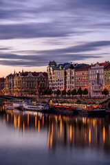 Fototapeta na wymiar Prague's waterside by the Vltava river called Prazska naplavka in twilight.