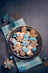 Decorated Gingerbread Christmas Cookies on Rustic Platter