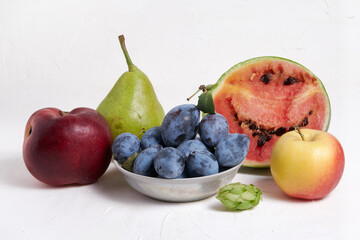 Fresh, juicy and ripe fruits on a white background. Autumn harvest
