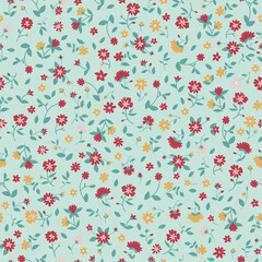 Seamless floral pattern. Cute red, yellow, pink flowers on a light green background. Ditsy print texture. Vector illustration for textile, wallpaper, fabric.