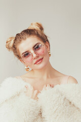 Beautiful fashionble woman in cozy fur coat