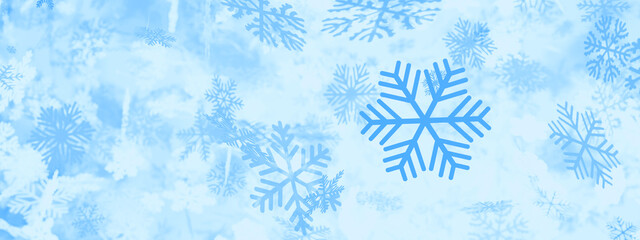 Blue background with 3d rendered snowflakes falling from the sky