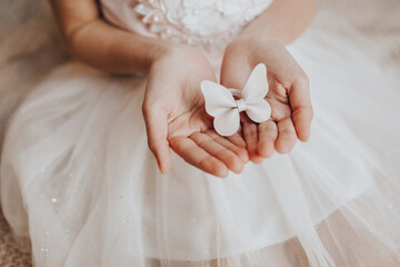 hair clip in the hands of a girl. bow