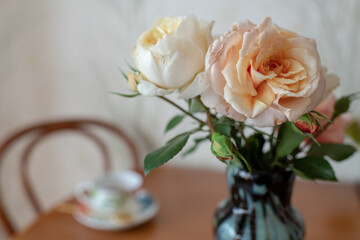 Photography to theme beautiful bouquet roses in vase on wooden table