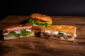 composition of sandwiches with salami and vegetables