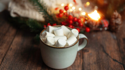 coffee with marshmallows in a cup on the background of a Christmas decor , the concept of Christmas