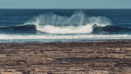 Beautiful wave crashing on Scottish coast 