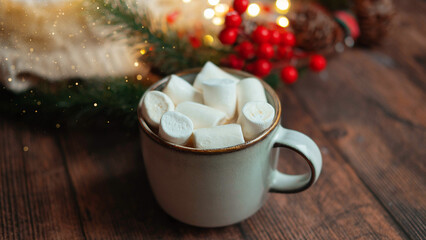 coffee with marshmallows in a cup on the background of a Christmas decor , the concept of Christmas