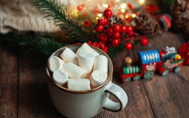 coffee with marshmallows in a cup on the background of a Christmas decor , the concept of Christmas