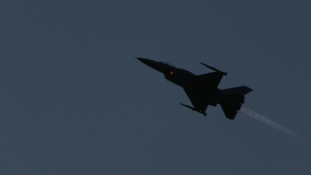 Fighter jet flying at night