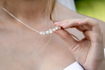 Morning gathering of the bride. Necklace. Beautiful neckline. Decoration for the bride. Close-up
