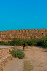Man walking in Rohtas Fort towards the wall