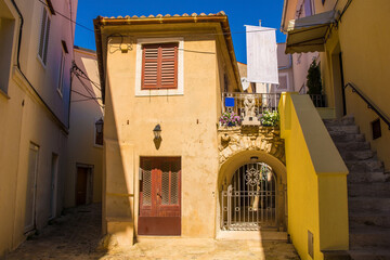 Houses in a quiet residential street in the historic medieval centre of Krk Town on Krk Island in the Primorje-Gorski Kotar County of western Croatia
