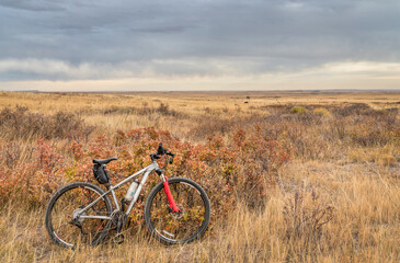 Fototapeta na wymiar mountain bike on a single track trail in Colorado prairie - Soapstone Prairie Natural Area with last fall colors in late October