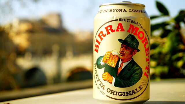 Rome, Italy - March 03, 2019: Can of Moretti beer on a low wall with a blurred background. is an Italian brewing company, founded in Udine in 1859 by Luigi Moretti acquired in 1996 by Heineken 