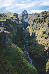 waterfall and river in the mountains in Iceland 
