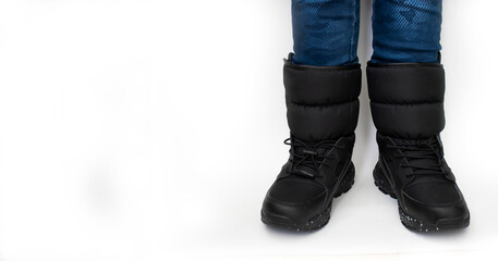 legs in winter boots isolated on white background
