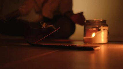 Sandarova aroma stick close-up. Burning candle and smoke during meditation.