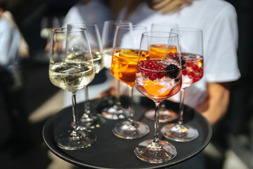 Alcoholic drinks on a tray at a wedding reception