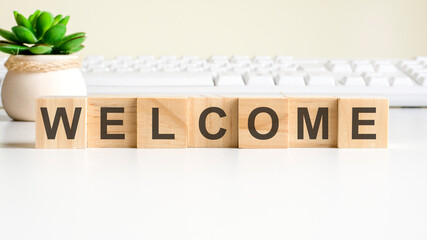 welcome word made with wooden blocks, concept