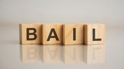 Four wooden cubes with letters Bail. Business marketing concept